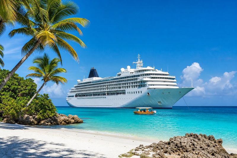 Cruise ship anchored off a Caribbean beach with turquoise water
